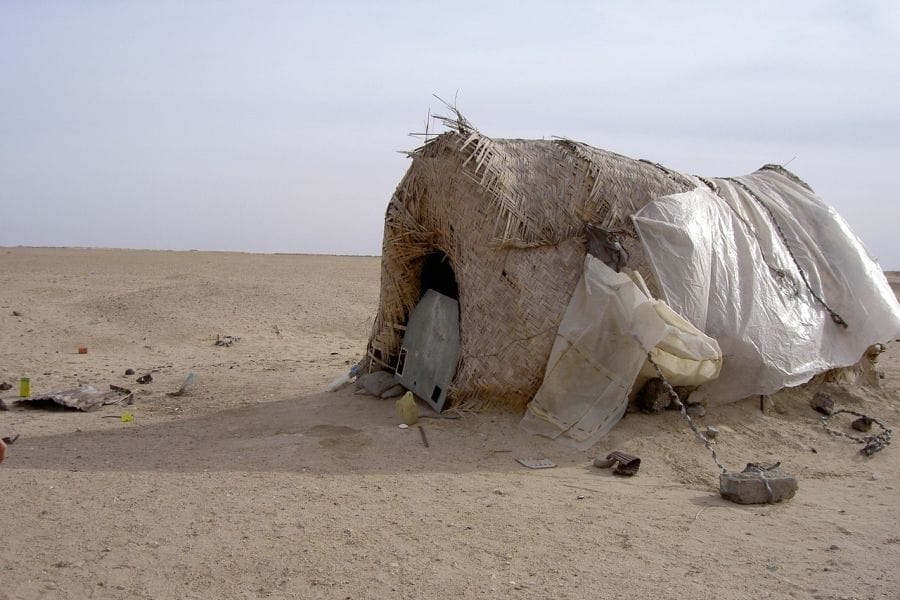 An emergency shelter made partially from plastic bags.