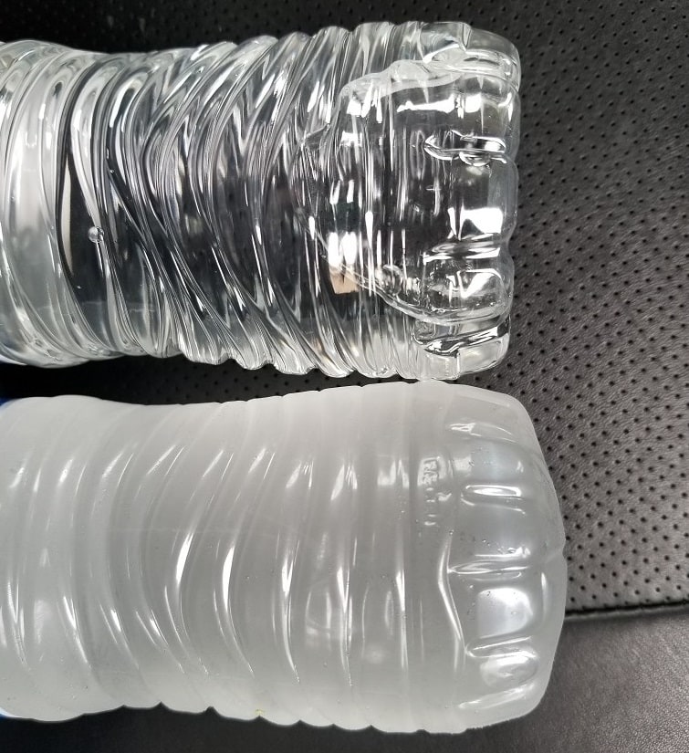 Frozen versus unfrozen bottles of water.