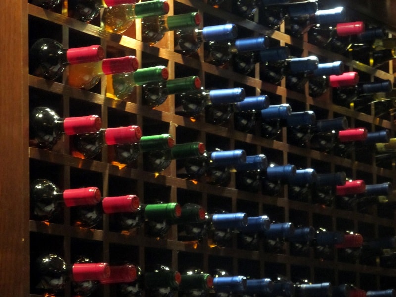 A wine rack with a large selection of wines.